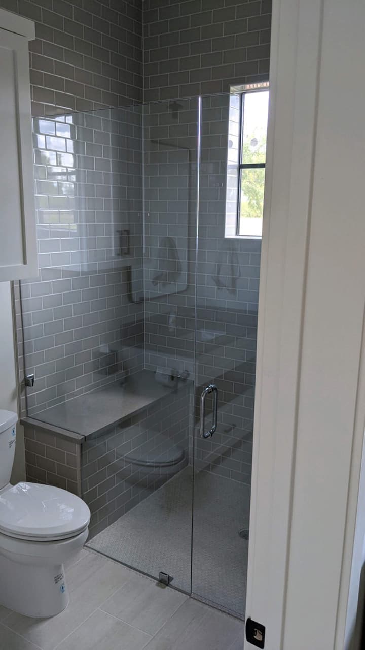 Custom frameless shower door installation completed by Door Pro Plus