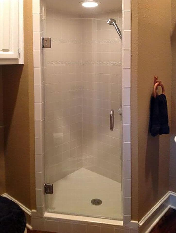 Frameless glass shower door installed by Door Pro Plus for a Marble Falls, TX bathroom remodel