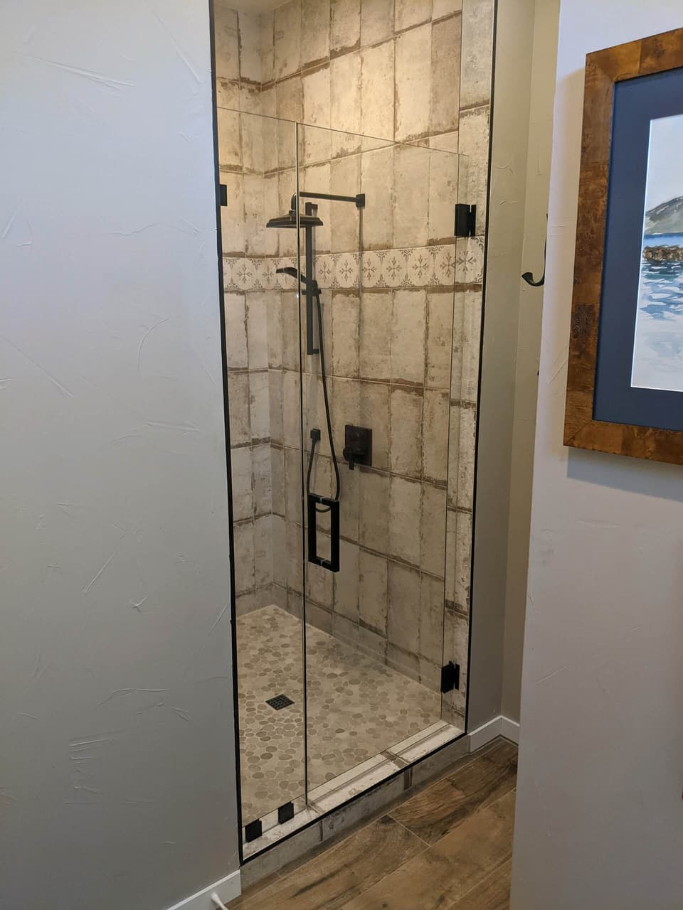 Frameless shower door installed by Door Pro Plus in a Texas Hill Country home