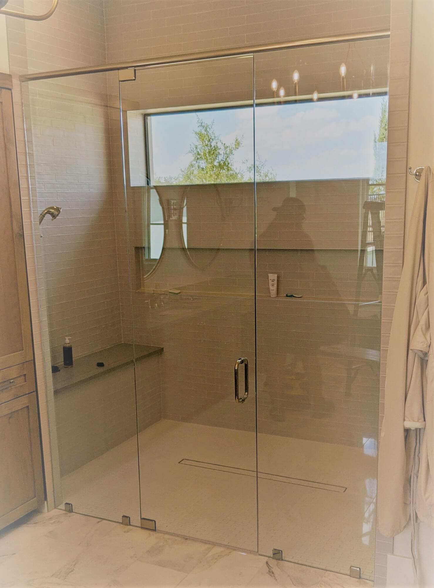 Custom frameless glass shower door installed by Door Pro Plus in a Marble Falls, TX bathroom