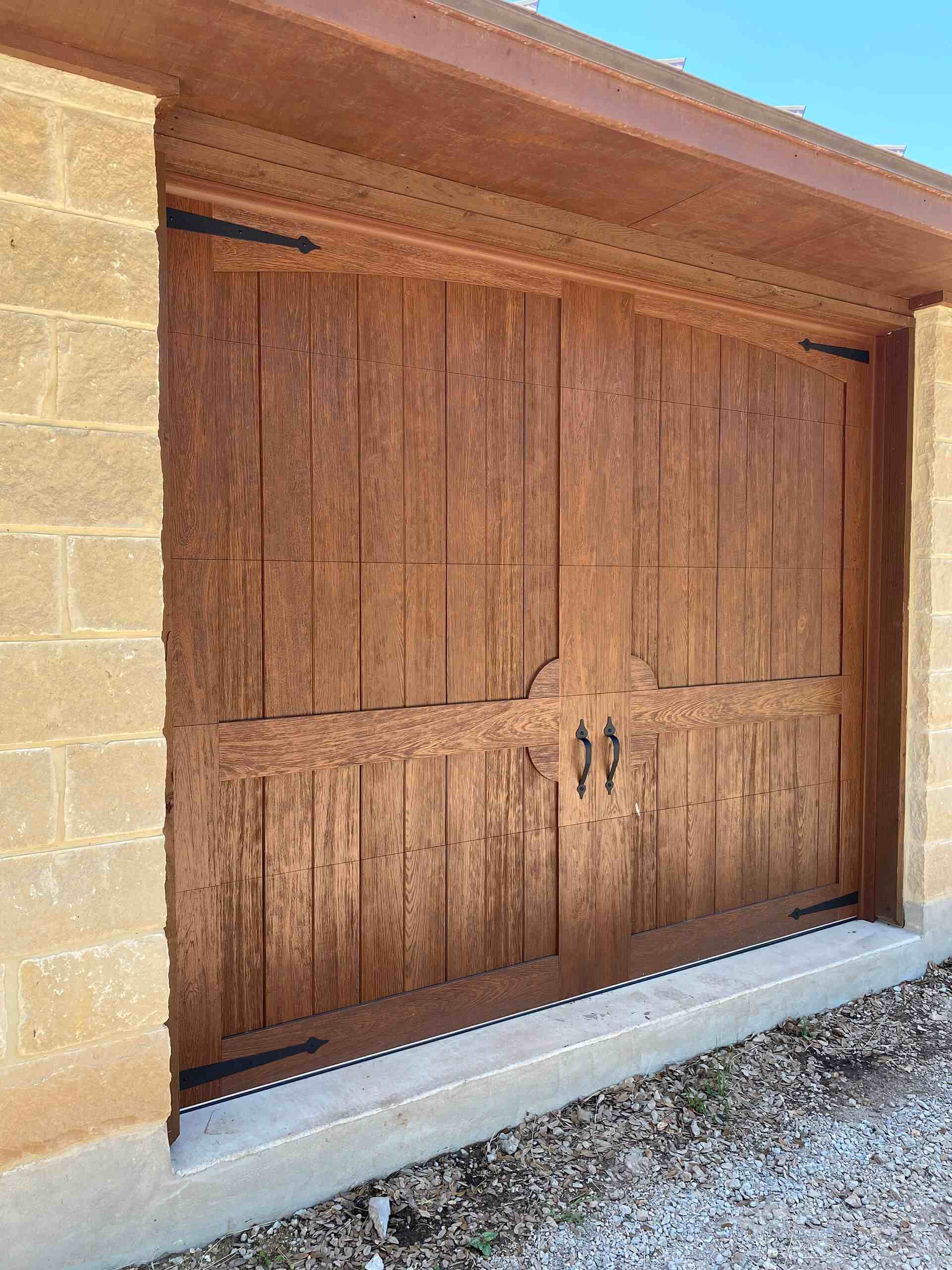Steel garage door installed by Door Pro Plus on a Marble Falls, TX residence